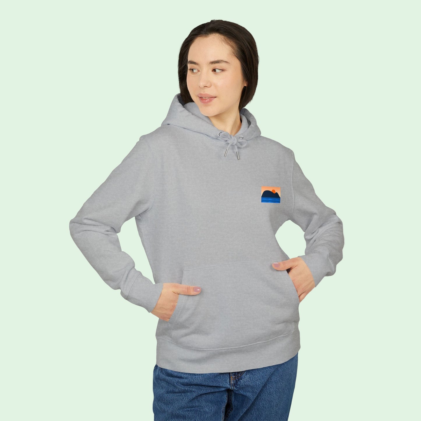 a woman wearing an organic cotton hoodie in heather front by Aunti