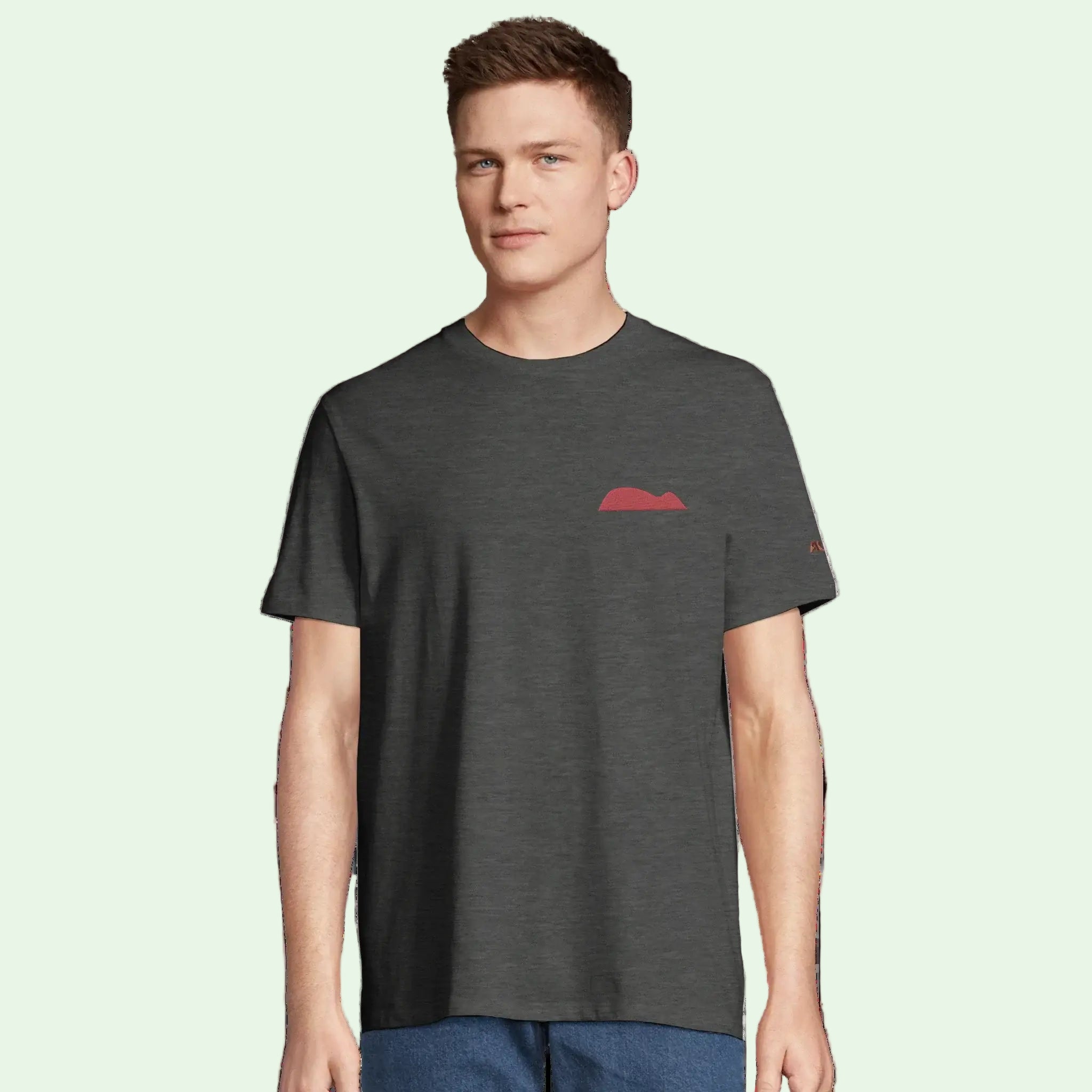 young man wearing an organic cotton in grey with raton of getaria embrodery on left chest