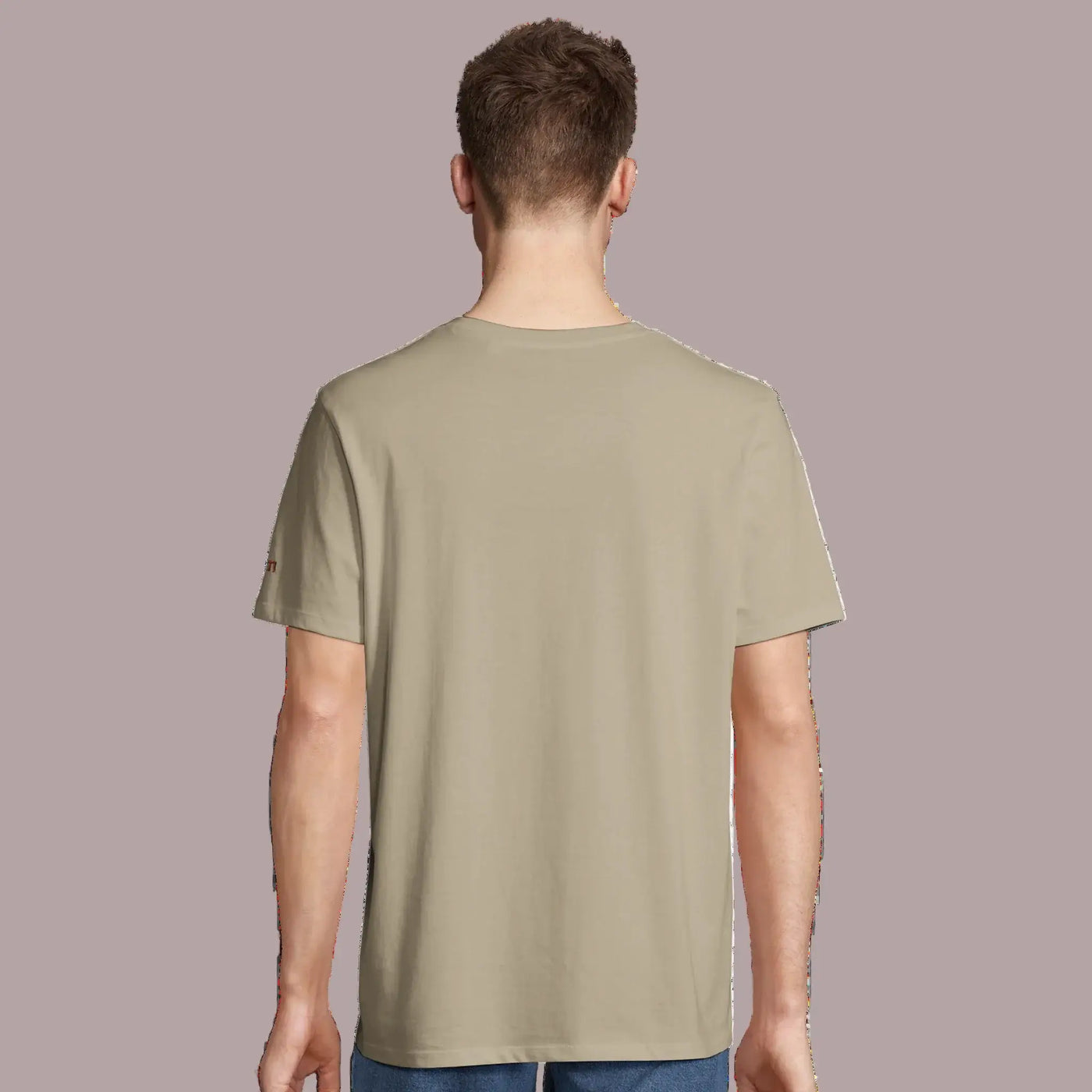 young man  wearing a khaki organic t-shirt from AUNTI, back view