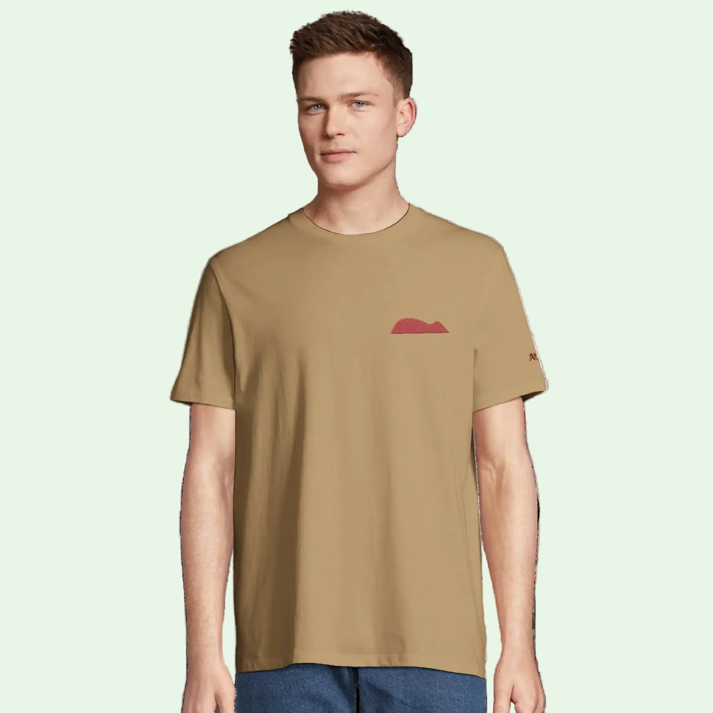 Young man wearing an organic cotton tee with mouse of getaria embrodery design 