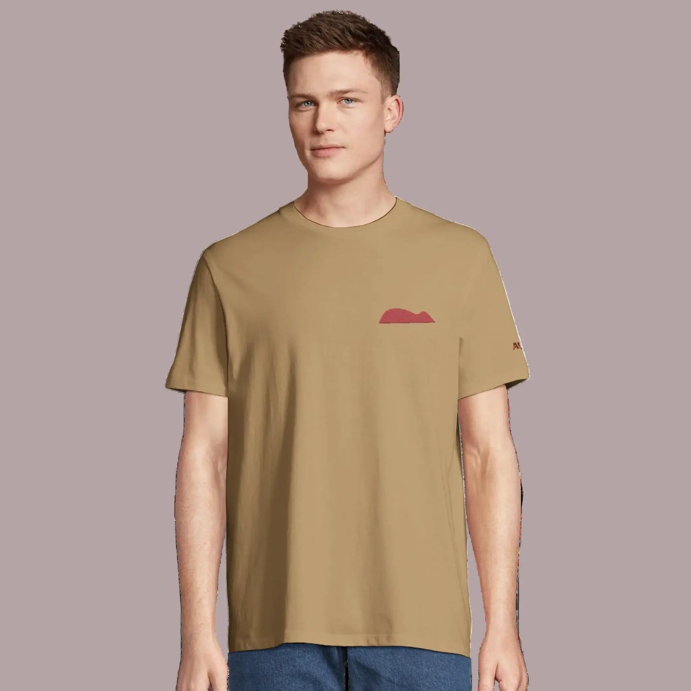 Young man wearing an organic cotton tee with mouse of getaria embrodery design 