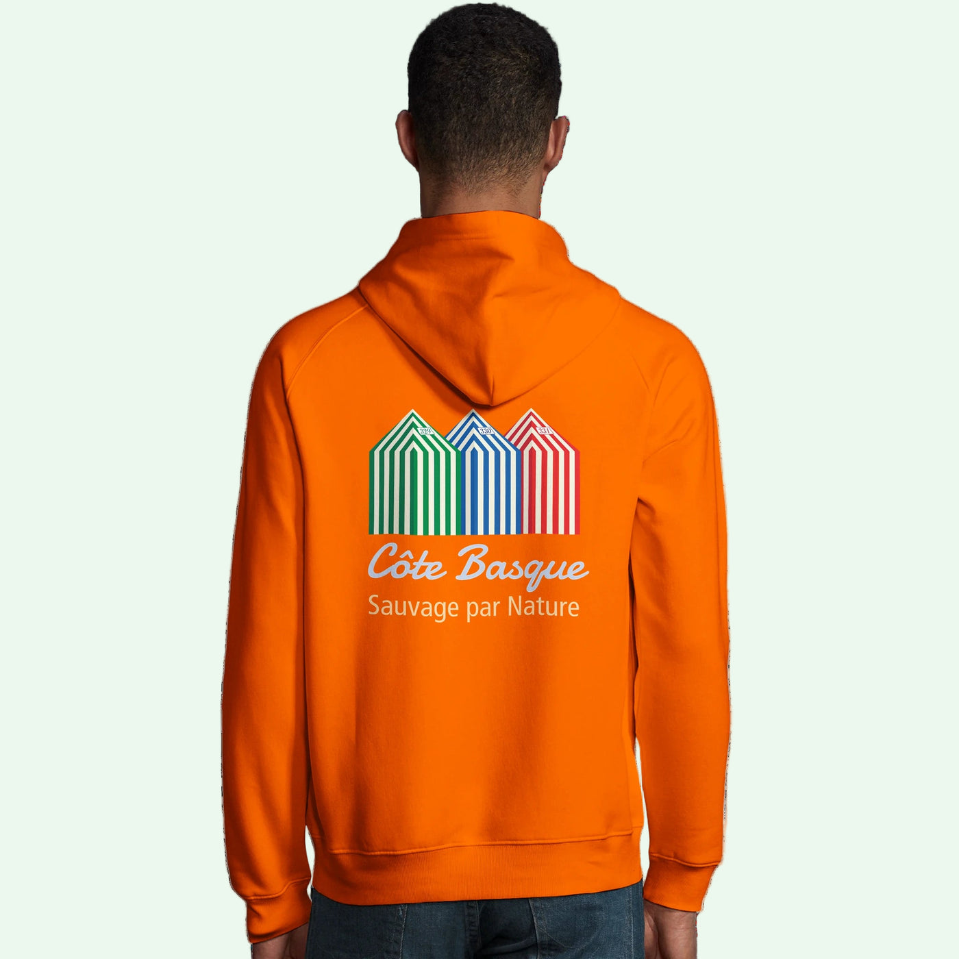 a man wearing an organic unisex orange hoodie with basque coast back design by Aunti