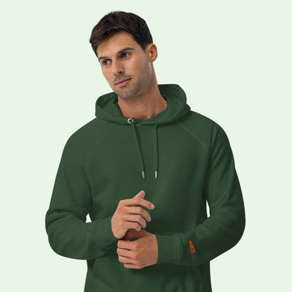a man wearing an unisex eco ranglan hoodie bottle green by aunti front view