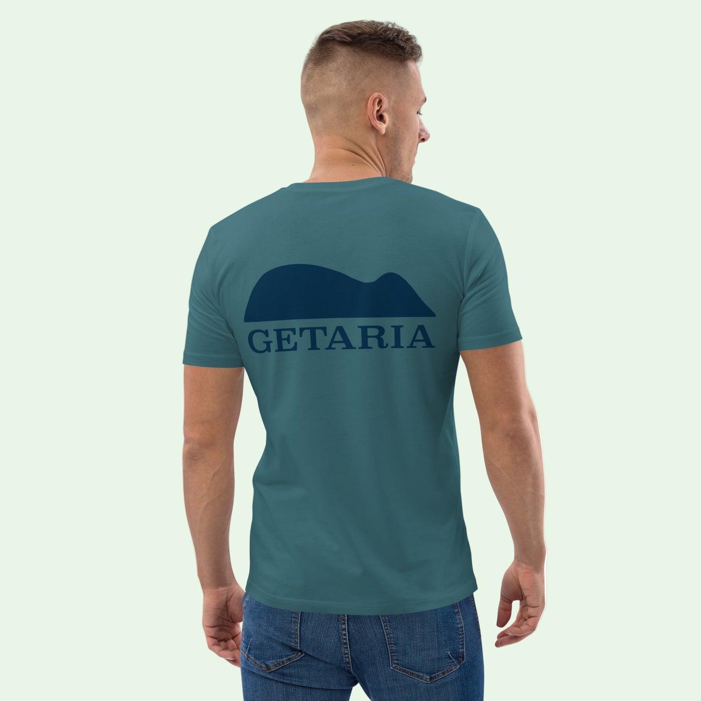 man wearing an unisex organic gots certified cotton t-shirt in stargazer with Getaria Mouse back desgn by Aunti