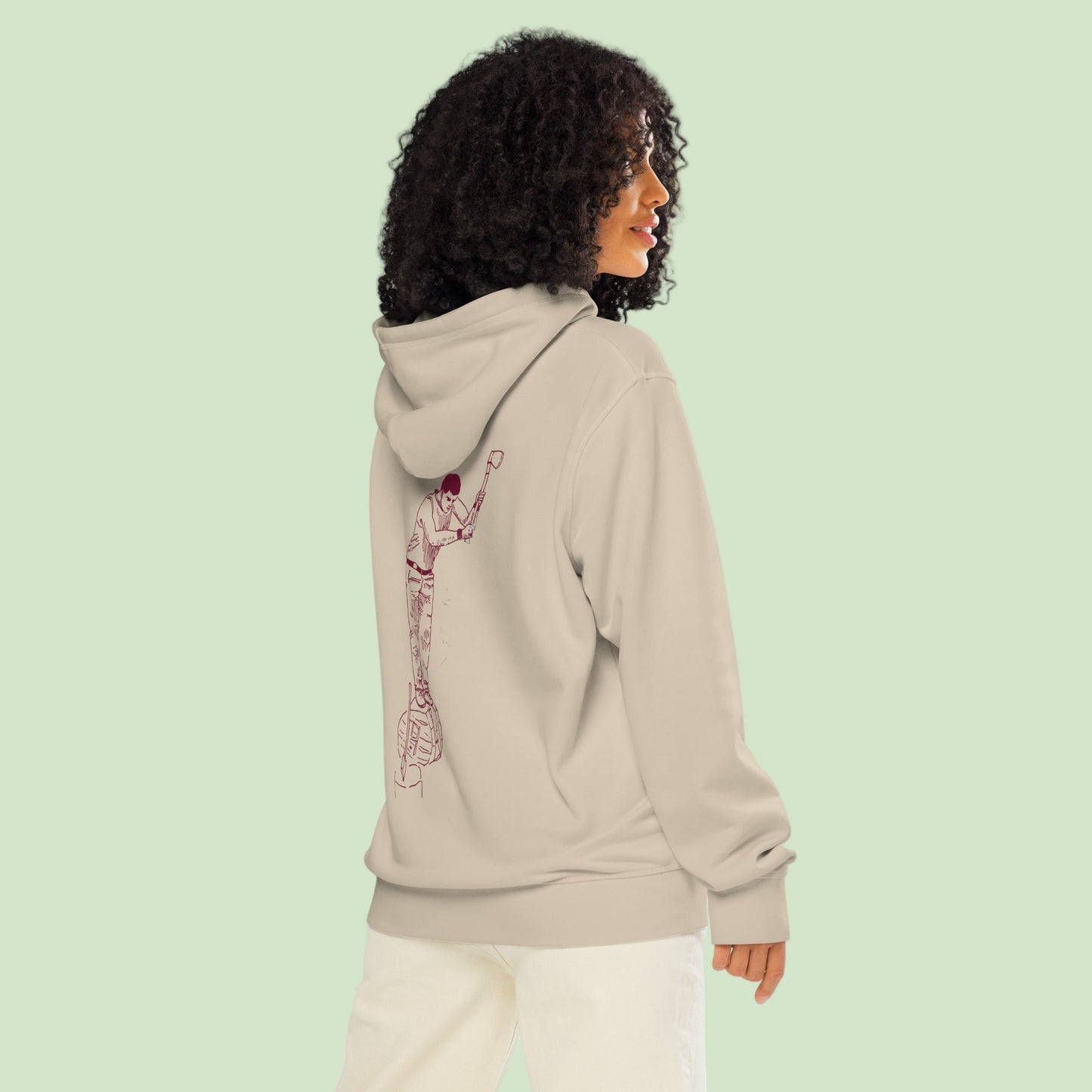 a woman wearing an unisex organic mid-weight hoodie in desert dust with a back aizkolari desgn by Aunti
