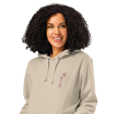 woman wearing a unisex organic hoodie with aizkolari design on chest