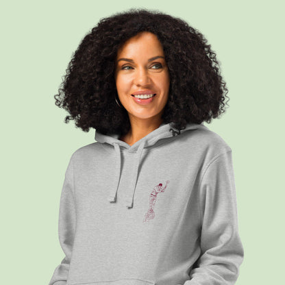 woman wearing a heather unisex organic mid-weight hoodie with aizkolari front design by Aunti